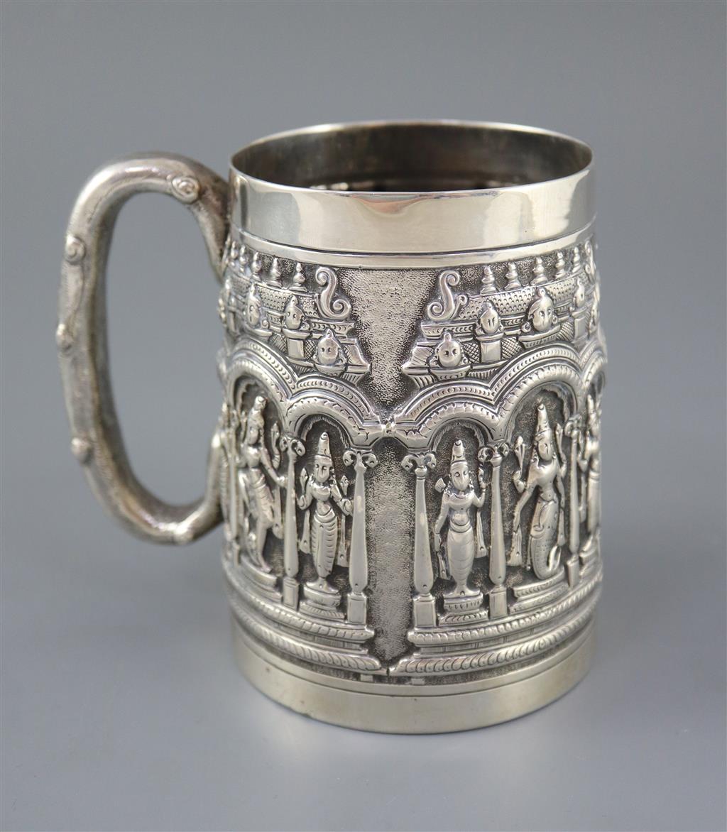 A late 19th century Indian repousse silver mug by P. Orr & Sons, Madras,